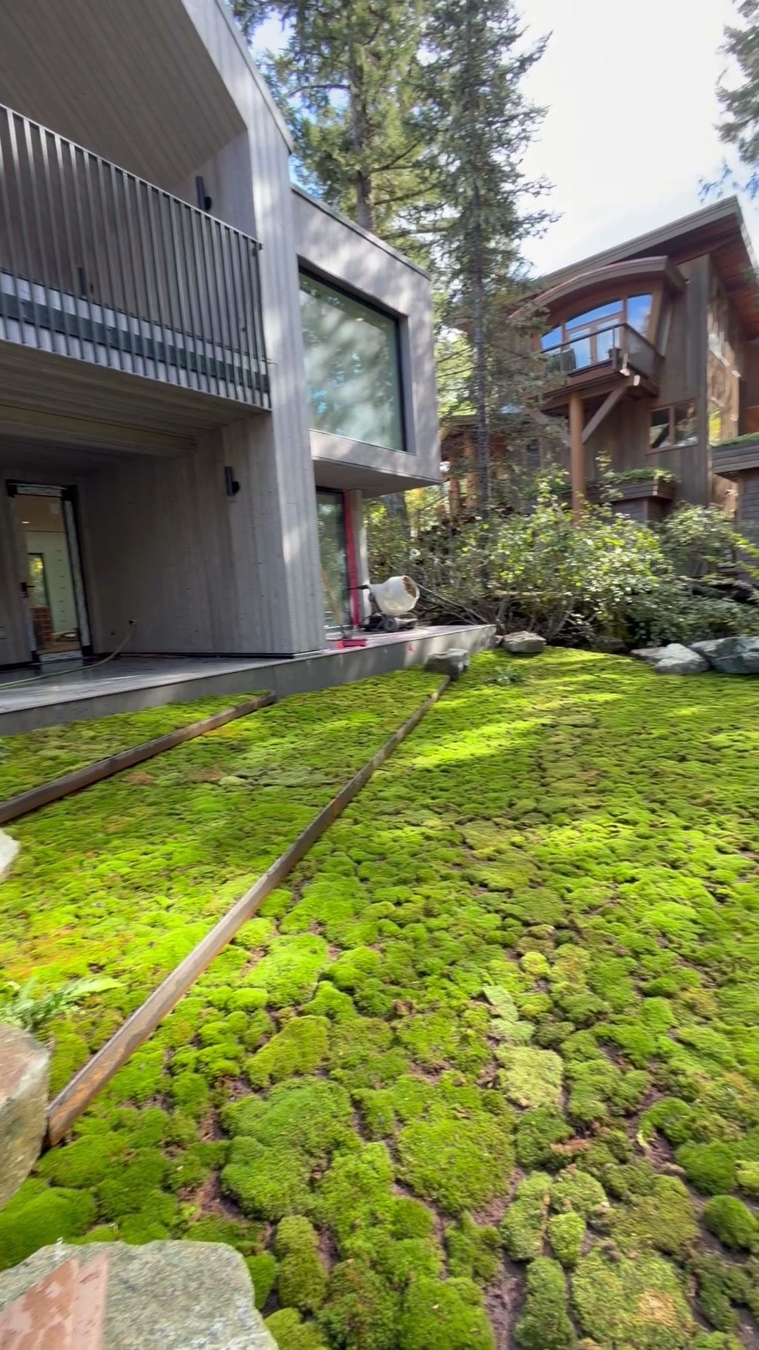 Terraced live moss beds beside a modern home in Whistler, BC